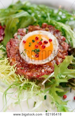 Beef tartare in plate, close-up shot
