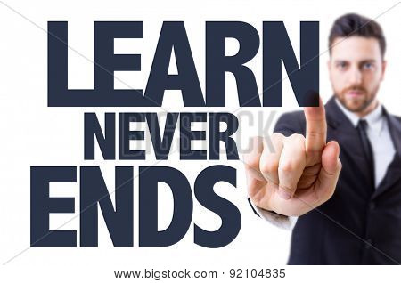Business man pointing the text: Learn Never Ends