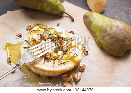 Delicious Baked Camembert With Honey, Walnuts, Herbs And Pears