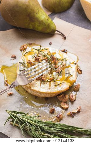 Delicious Baked Camembert With Honey, Walnuts, Herbs And Pears
