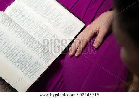 Expecting Mom Holding The Holy Bible