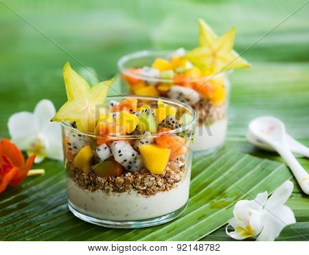 Healthy breakfast with exotic fruits, yogurt and granola