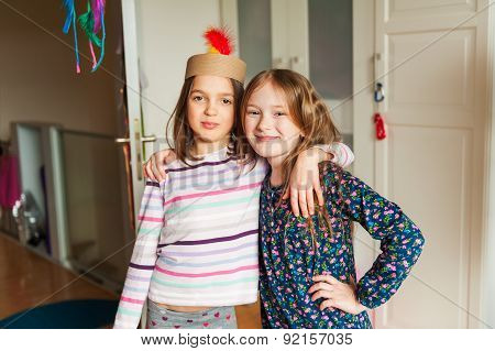 Two little girls playing in their room