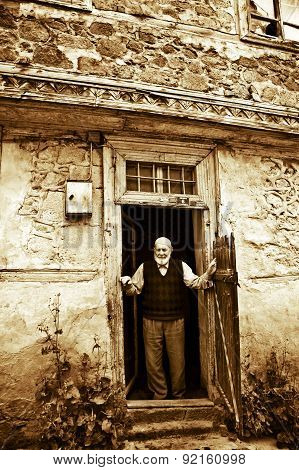 The Old Man Waiting At Doorway