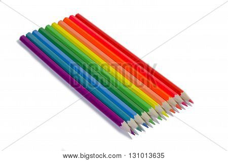 set of colored pencils on white drawing paper