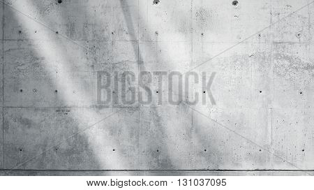 Horizontal Photo Blank Grungy Smooth Bare Concrete Wall with Sunrays Reflecting on Light Surface. Soft shadows. Empty Abstract background. Black and White.