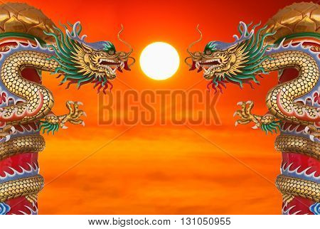 Chinese style dragon statue at beautiful sunset