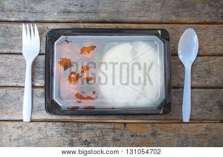 A box of lunch set on wood
