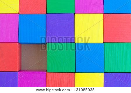 Children's toy - multicolored cubes (one cube is not enough) of roughly processed wood (rough surface)