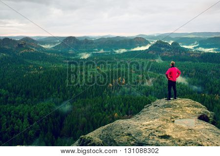 Runner In Pink Jacket And Light Black Trousers. Short Ginger Hair Man In His Target. Tired Sportsman
