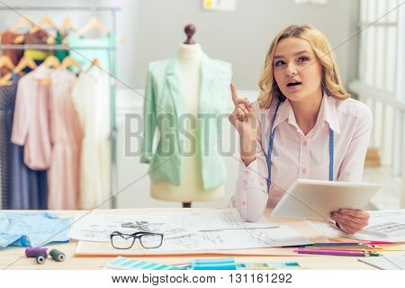 Beautiful Young Designer With Gadget