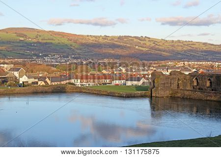Caephilly castle moat and town in Wales