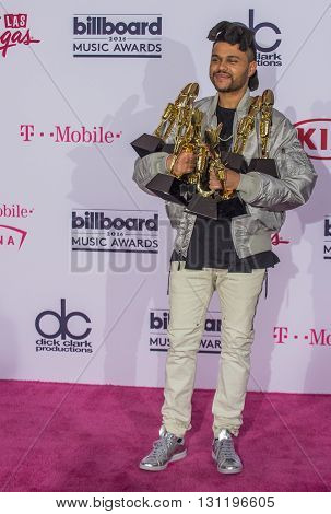 LAS VEGAS - MAY 22 : Recording artist The Weeknd poses in the press room at the 2016 Billboard Music Awards at T-Mobile Arena on May 22 2016 in Las Vegas Nevada.