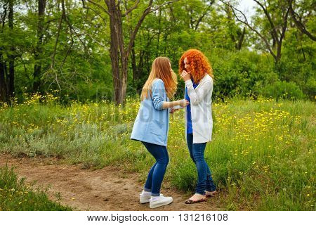 Best friends forever. Girlfriends spend time together in the park. BFF. Close friends. Gentle friendship. Girls laugh