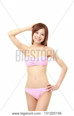 Japanese woman posing in a pink bikini