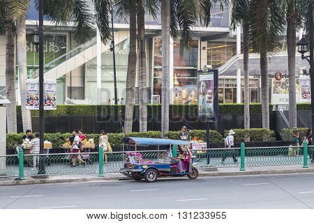 BANGKOK THAILAND - APR 17 : tuktuk is parking at CentralWorld on Ratchaprasong road on april 17 2016 thailand. tuktuk is popular taxi service of tourists in bangkok