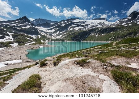 Turquoise lake in the high mountains. Summer mountain landscape. Weissee beautiful lake in Austrian mountains