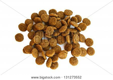 Dry pet food on an isolated background. Granules of good nutrition for dogs and cats. Food for the animals. Brown uniform pieces of dry food.