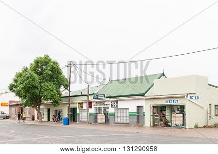 JANSENVILLE SOUTH AFRICA - MARCH 7 2016: A street scene in Jansenville a small town in the heart of the mohair industry of the Eastern Cape Karoo region. Falling rain is visible