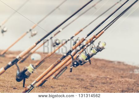 Fishing rod and lake Vintage color style