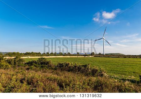 Wind turbines blades on the countryside and a blue sky