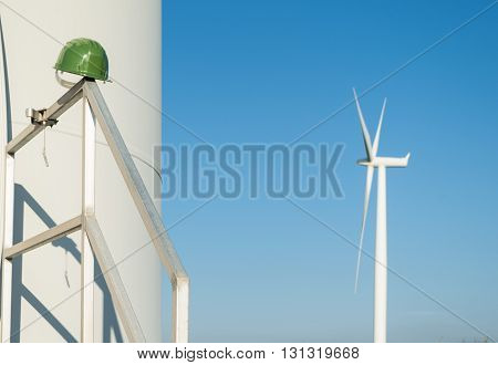 Wind turbines blades on the countryside and a blu sky as background