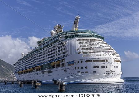 ROSEAU DOMINICA - APR 27 2016: the adventure of the seas anchors in Roseau. Roseau is a famous ship cruise port for exploring the island.