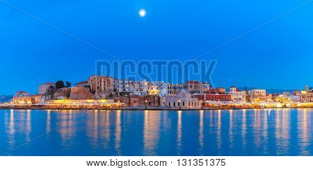 Panoramic view of Venetian quay of Chania with Kucuk Hasan Pasha Mosque during twilight blue hour, Crete, Greece