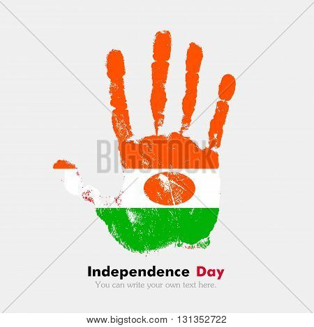 Hand print, which bears the Flag of Niger. Independence Day. Grunge style. Grungy hand print with the flag. Hand print and five fingers. Used as an icon, card, greeting, printed materials.