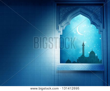 Ramadan Kareem background.Mosque window with shiny crescent moon