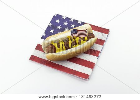 Hotdog on an American flag napkin and toothpick
