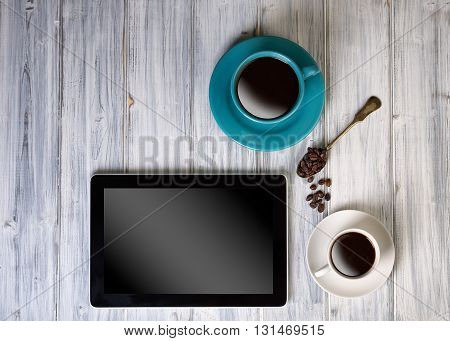 Coffee And Tablet On The Table