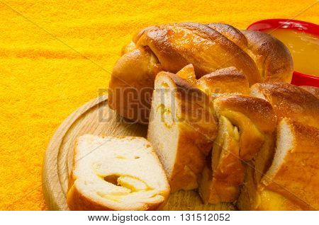 peach strudel to a wooden Board with natural honey in a red bowl