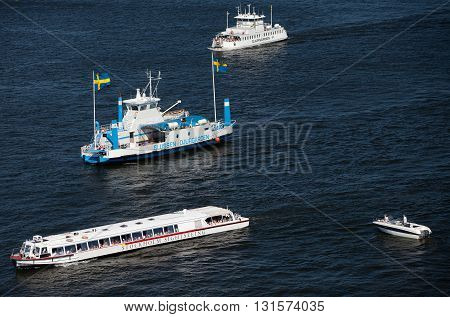 SWEDEN, STOCKHOLM - JUNE 05, 2011: Touristic ferries, sightseeing ships and boats in Strommen strait in Saltsjon bay in Stockholm
