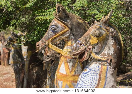 Chettinad India - October 16 2013: Ayyanar village protector Horse shrine of Namunasamudran. Two old clay horse heads are smiling. Painted bodies.