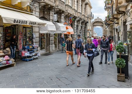 TAORMINA ITALY - MAY 21: Tourists shopping in the main street Corso Umberto of Taormina on May 21 2016 at the island Sicily Italy
