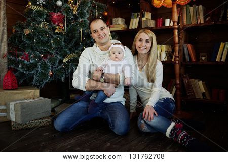 photo of happy family in christmas decorated room