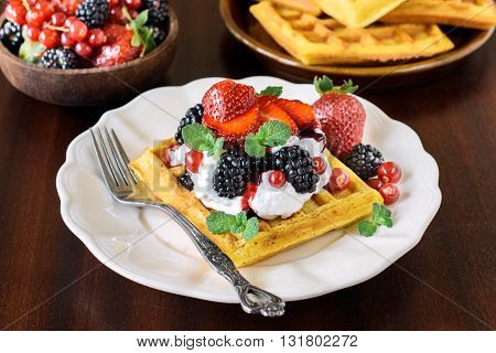 Belgium waffles in the plate on rustic background