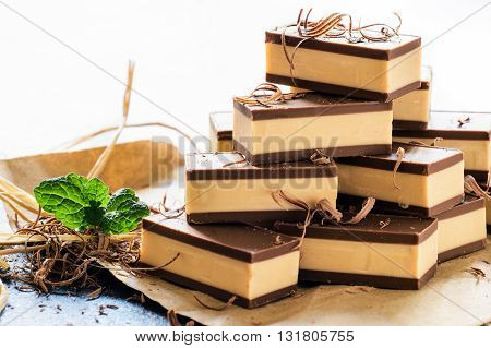 Photos of sweet pralines on rustic background