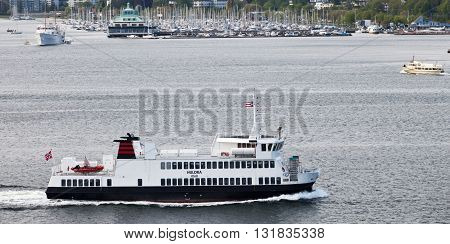 OSLO, NORWAY - MAY 17, 2012: Small ferry Huldra is transporting passengers in the waters of Oslo
