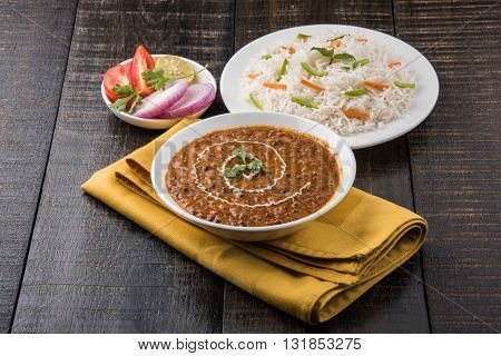 Dal makhani or dal makhni a Buttery Lentils made up of black gram, served with indian bread or chapati and rice