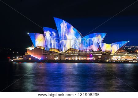 Sydney Australia - 2016 May 27: Annual outdoor lighting festival Vivid Sydney: Festival of Light Music and Ideas. Sydney Opera House illumination Lighting the Sails Songlines. Long Exposure
