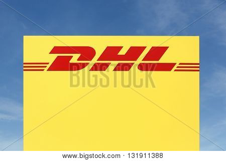Skanderborg, Denmark - May 26, 2016: DHL logo on a panel.DHL Express is a division of the german logistics company Deutsche Post DHL providing international express mail services.