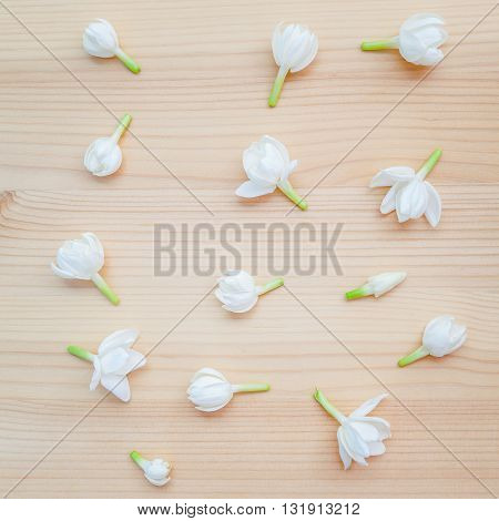 White Jasmine Flowers On Wooden Background. The Delicate Rain Season Flowers.