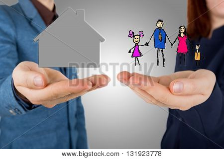 Family life insurance and proprety insurance protecting family family concepts.Man and woman hands making protection gesture.