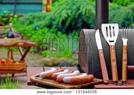Summer Weekend Bbq Scene With Charcoal Grill On The Backyard