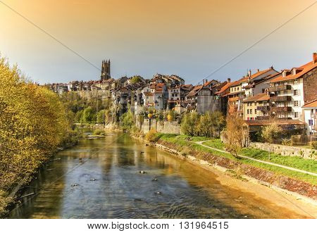 Panoramic view of cathedral of St. Nicholas and Sarine river in Fribourg, Switzerland