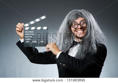 Funny man with movie clapboard