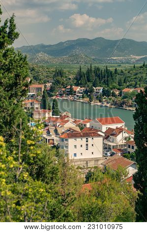 Inspirational Beautiful Landscape In Mediterranean Town With Sea, Coast And Valley. City In Green Va