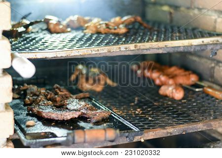 Brazilian Meat Grilling At A Churrasco On A Churrasqueira